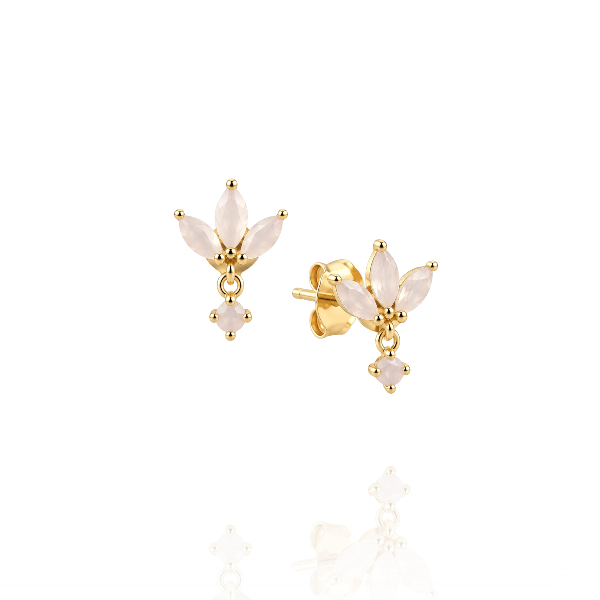 A pair of gold stud earrings featuring marquise-cut pale pink stones arranged in a small flower shape with a dangling heart-shaped accent, shown on a clean white background with a soft reflection below.