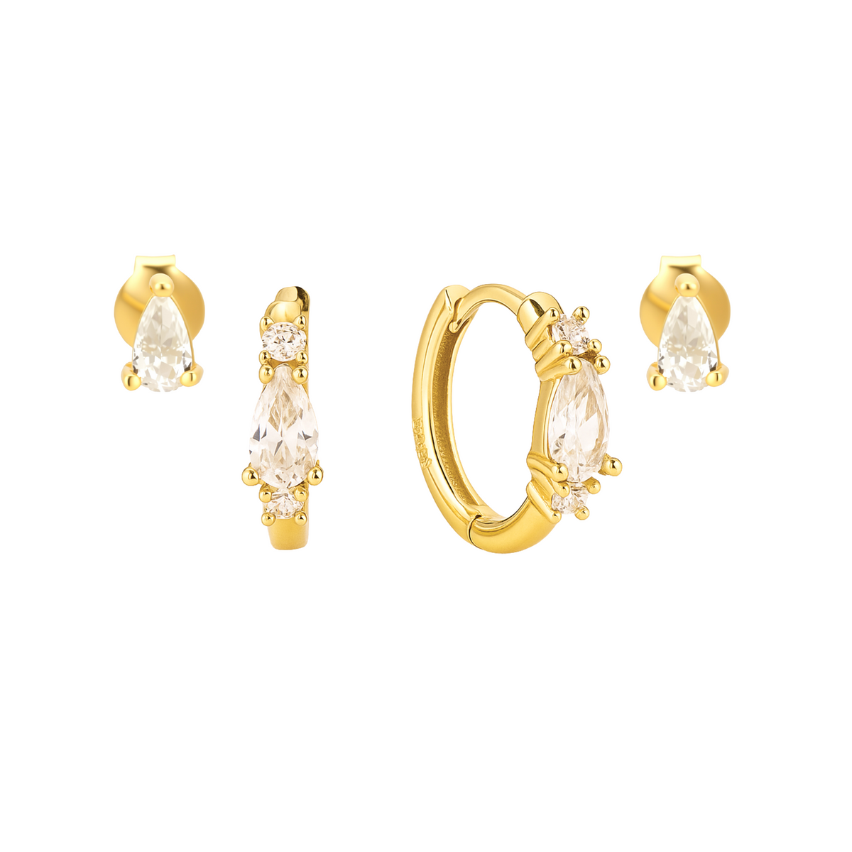 Set of gold earrings with clear gemstones on a white background