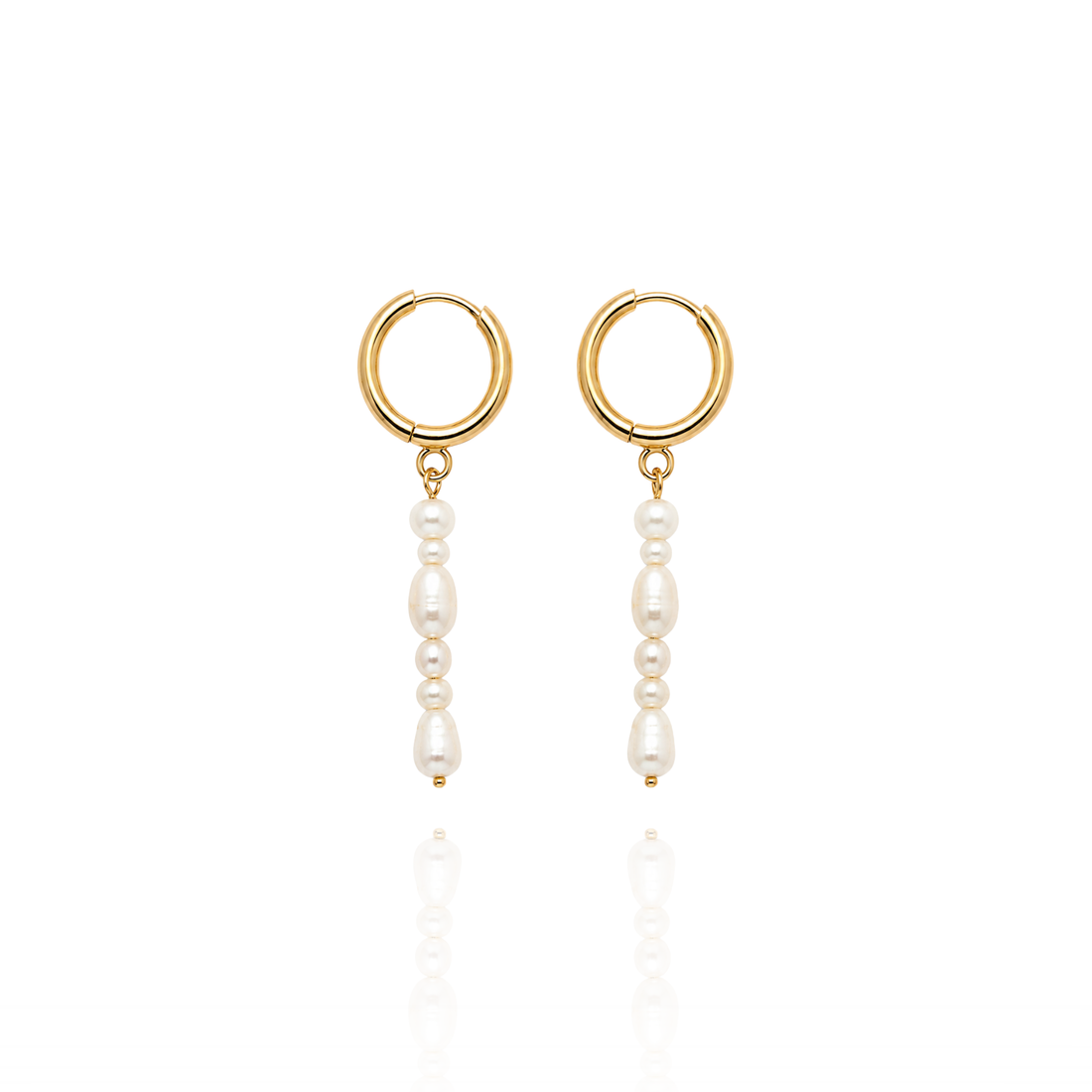 A pair of gold hoop drop earrings with dangling white pearl beads, shown on a clean white background with a soft reflection below.